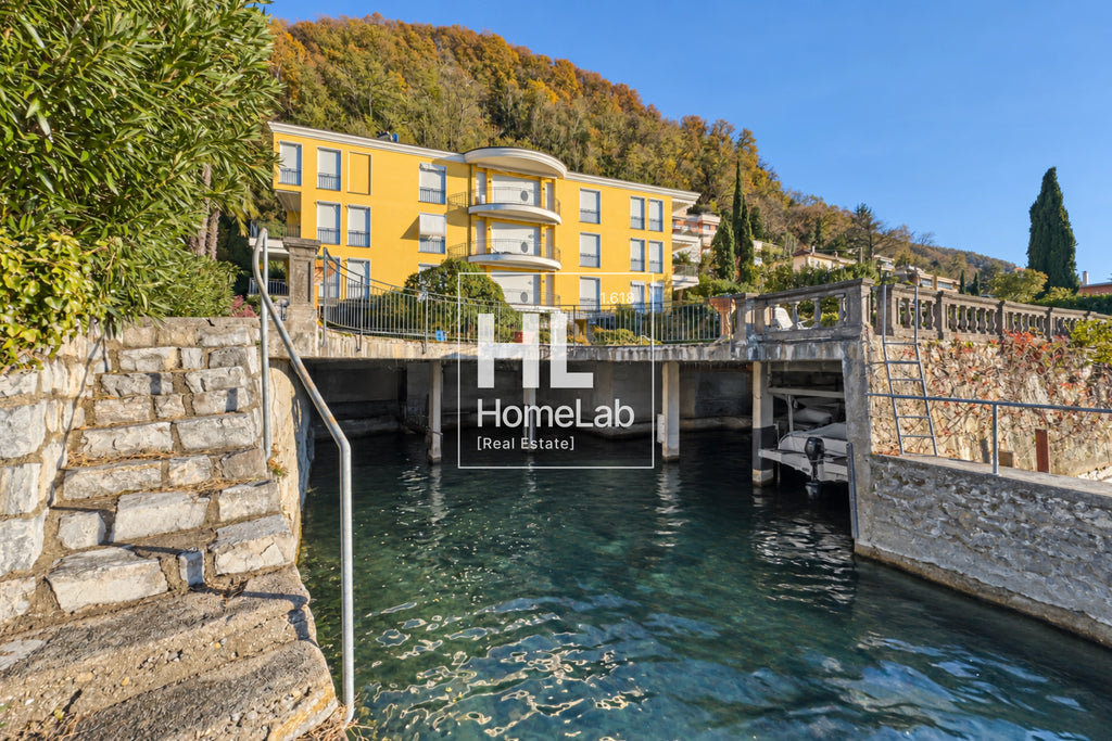 APPARTAMENTO FRONTE LAGO CON TERRAZZA, PISCINA E POSTO BARCA A BISSONE